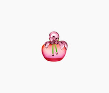 Charger l'image dans la galerie, Nina Illusion - A pink, floral-themed perfume bottle with a clear liquid visible inside and decorative green accents.